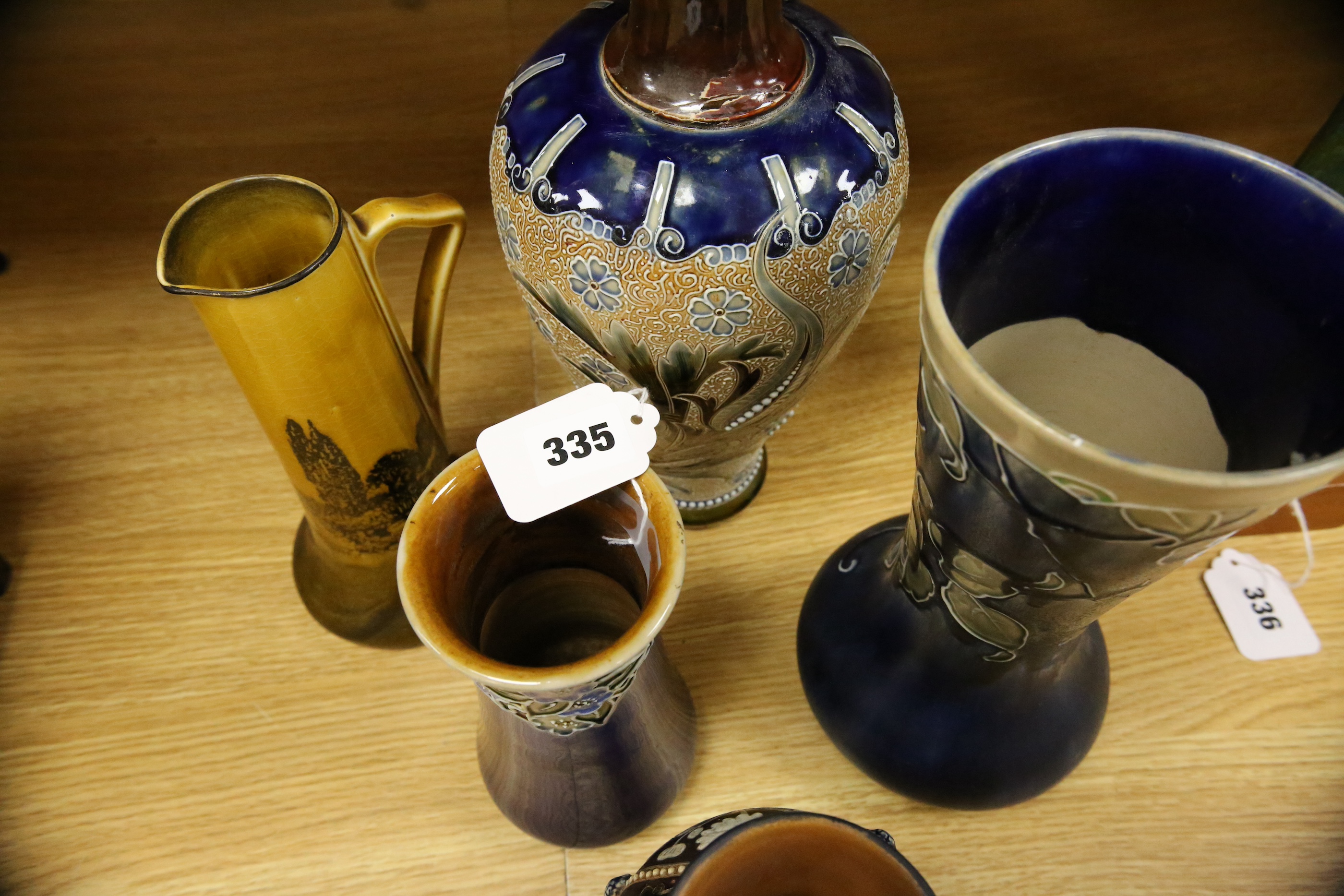 Four Royal Doulton vases and a yellow glazed jug items, tallest vase 34cm high. Condition - some crazing and faults, large vase has damage to lower neck